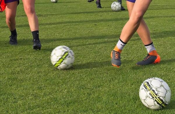Female football kicking
