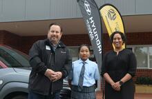 Competition winner Sui in the driving seat