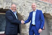 Football Futures Foundation Chairman Nick Tana, left, welcomes the charity’s new Executive Officer Brent Hedley.